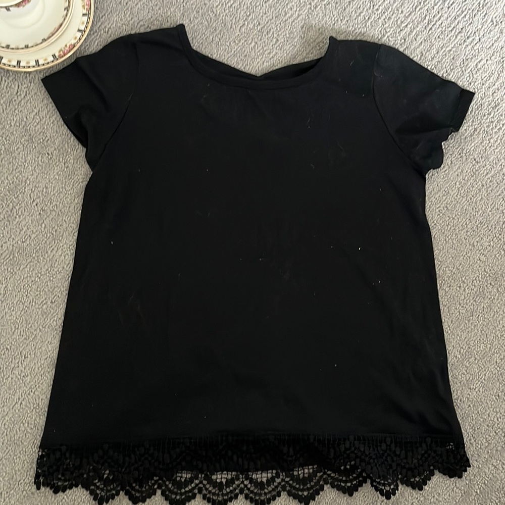 Black blouse with cross back and lace trim